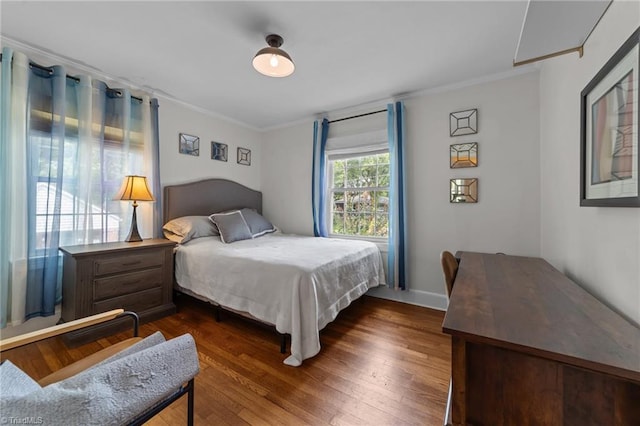 2607 Sherwood St, Greensboro, NC 27403 - bedroom with ornamental molding and dark wood-style flooring