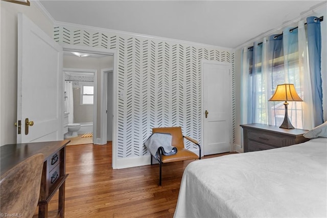 2607 Sherwood St, Greensboro, NC 27403 - bedroom featuring crown molding, wood finished floors, and wallpapered walls