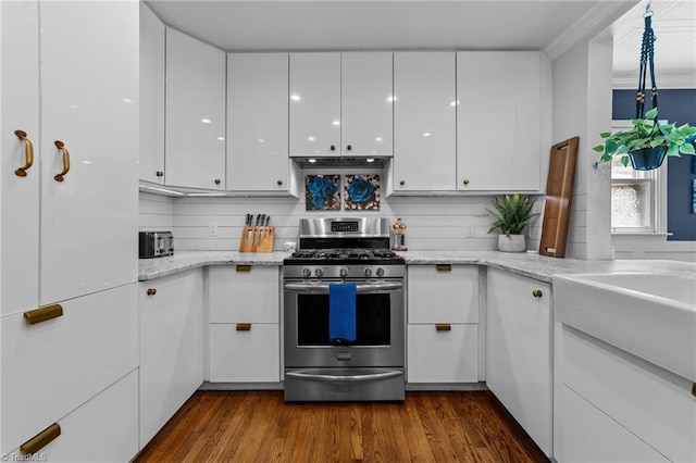 2607 Sherwood St, Greensboro, NC 27403 - kitchen featuring stainless steel range with gas cooktop, white cabinetry, and under cabinet range hood
