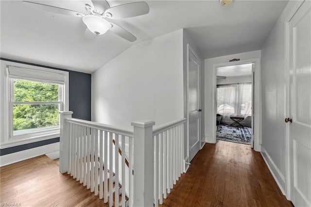 2607 Sherwood St, Greensboro, NC 27403 - hallway featuring an upstairs landing, wood finished floors, and vaulted ceiling