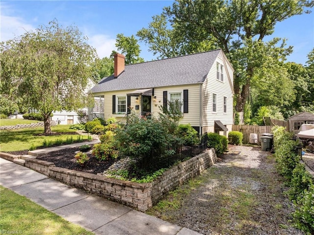 2607 Sherwood St, Greensboro, NC 27403 - view of front of home featuring a chimney, roof with shingles, and driveway