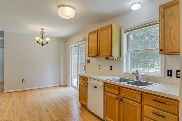 5201 Harvey Rd, Jamestown, NC 27282 - kitchen with white dishwasher, a chandelier, light wood-style floors, and plenty of natural light