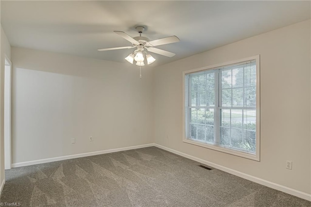 5201 Harvey Rd, Jamestown, NC 27282 - spare room with dark carpet and ceiling fan