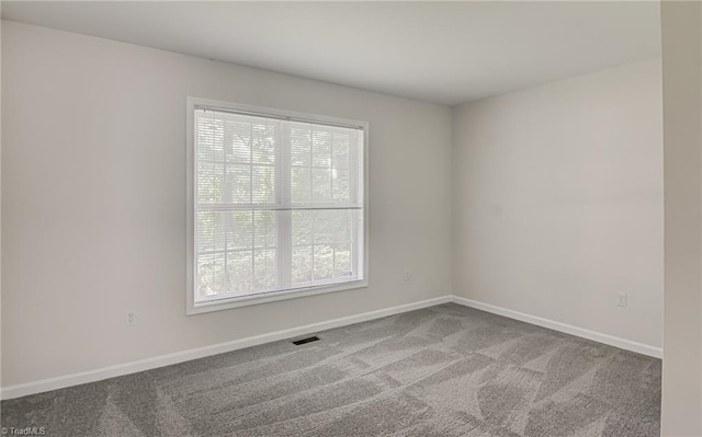 5201 Harvey Rd, Jamestown, NC 27282 - empty room featuring plenty of natural light and carpet floors