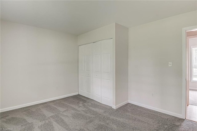 5201 Harvey Rd, Jamestown, NC 27282 - unfurnished bedroom featuring carpet floors and a closet