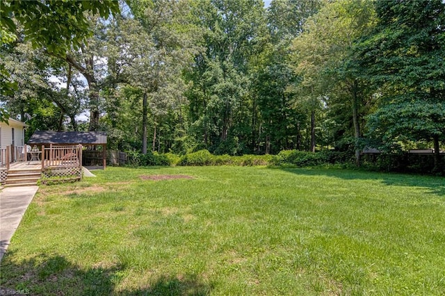 5201 Harvey Rd, Jamestown, NC 27282 - view of green lawn with a deck