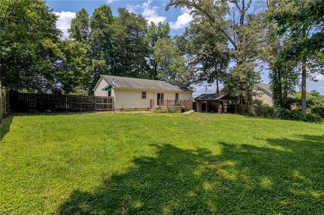 5201 Harvey Rd, Jamestown, NC 27282 - fenced backyard with a wooden deck