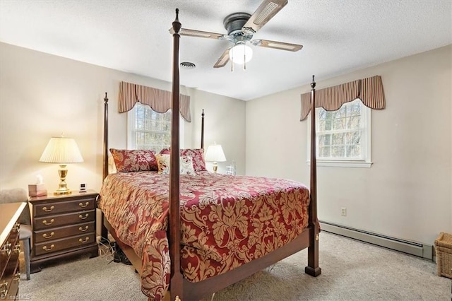 bedroom with ceiling fan, multiple windows, light carpet, and a baseboard radiator