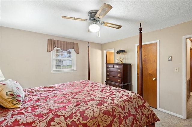 bedroom with light carpet, a textured ceiling, and ceiling fan