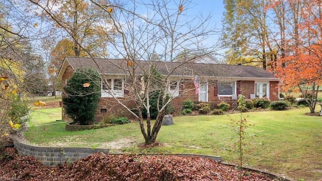 ranch-style house with a front yard