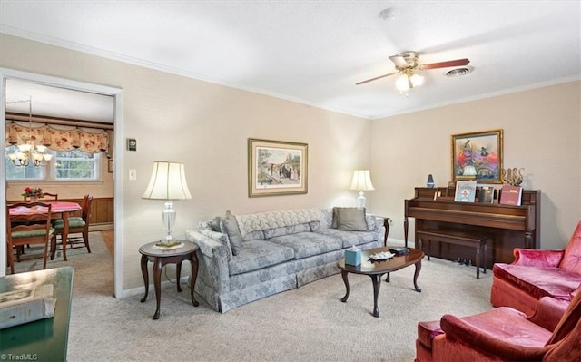 carpeted living room with ceiling fan with notable chandelier and ornamental molding