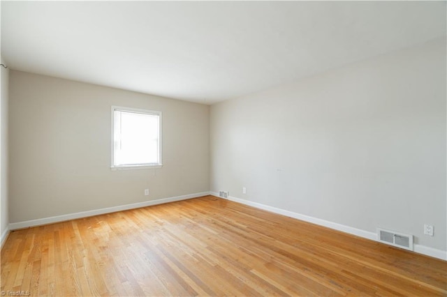 spare room with light wood-type flooring