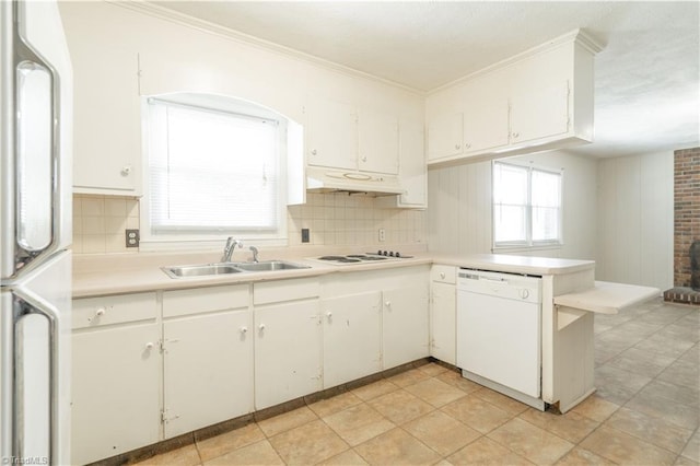 kitchen with white cabinets, sink, and white appliances