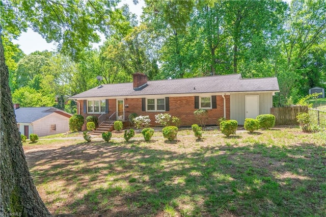 single story home with a front yard