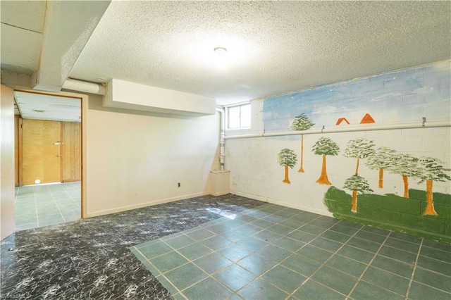 basement with tile floors and a textured ceiling