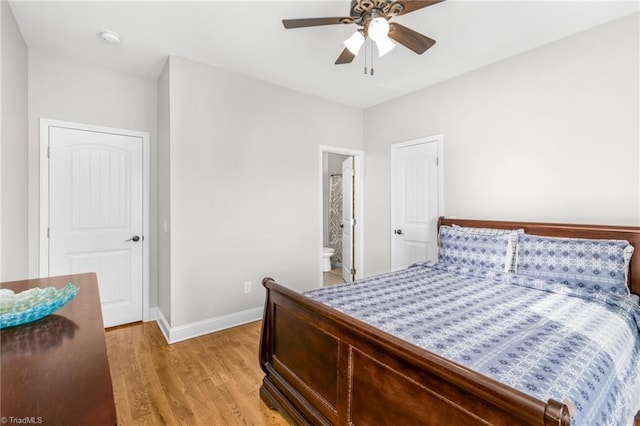 bedroom with connected bathroom, light hardwood / wood-style flooring, and ceiling fan