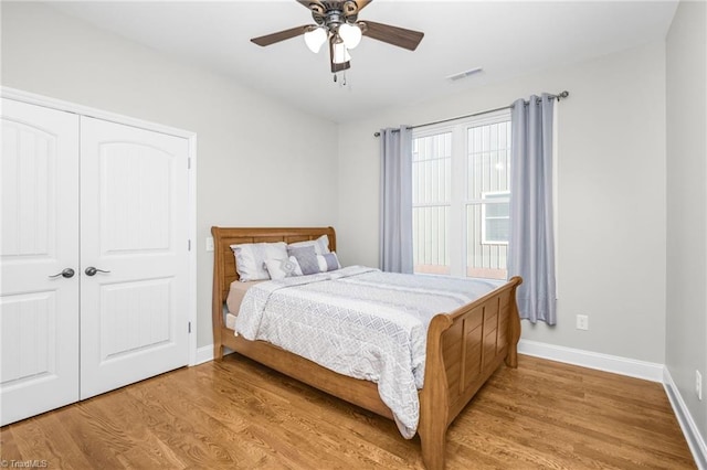 bedroom featuring a closet, ceiling fan, and light wood-type flooring