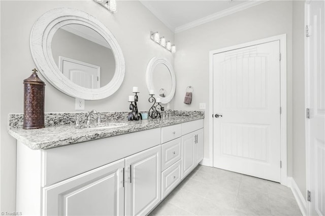 bathroom with tile patterned floors, ornamental molding, and vanity