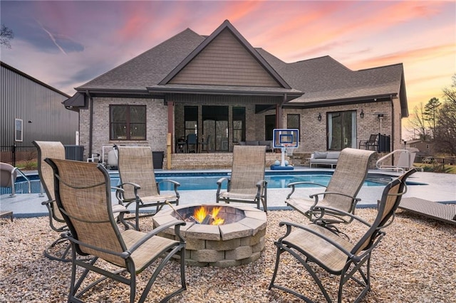 exterior space with a patio area and an outdoor fire pit