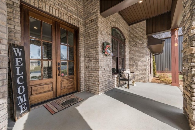 property entrance with french doors and a porch