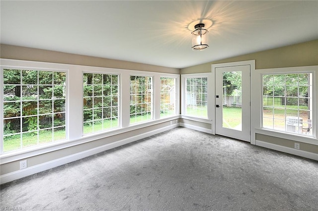2700 Regency Dr, Winston-Salem, NC 27106 - unfurnished sunroom with carpet, baseboards, and lofted ceiling
