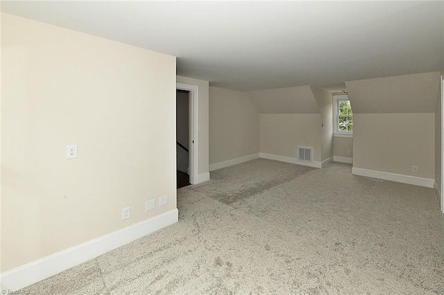 2700 Regency Dr, Winston-Salem, NC 27106 - additional living space featuring vaulted ceiling, baseboards, and carpet floors