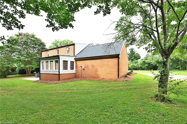 2700 Regency Dr, Winston-Salem, NC 27106 - back of house featuring a lawn and roof with shingles