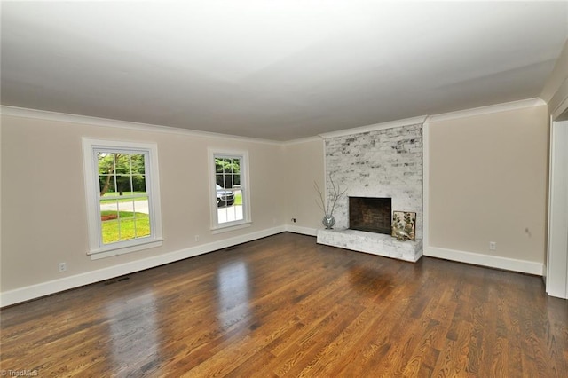 2700 Regency Dr, Winston-Salem, NC 27106 - unfurnished living room featuring dark wood-style flooring, ornamental molding, baseboards, and a brick fireplace