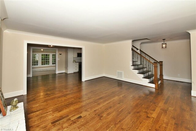 2700 Regency Dr, Winston-Salem, NC 27106 - unfurnished living room with crown molding, wood finished floors, stairs, and baseboards