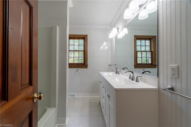 bathroom featuring vanity, tile walls, crown molding, tile patterned flooring, and independent shower and bath