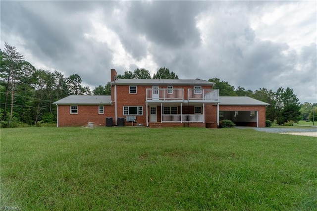 view of front of home with a front yard and cooling unit