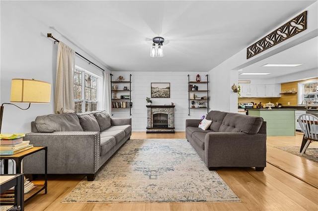 living room with sink and light hardwood / wood-style floors