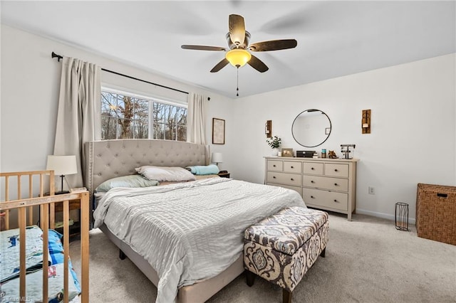 bedroom featuring ceiling fan and light colored carpet