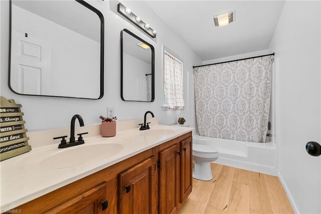 full bathroom with toilet, vanity, shower / bath combo with shower curtain, and hardwood / wood-style flooring