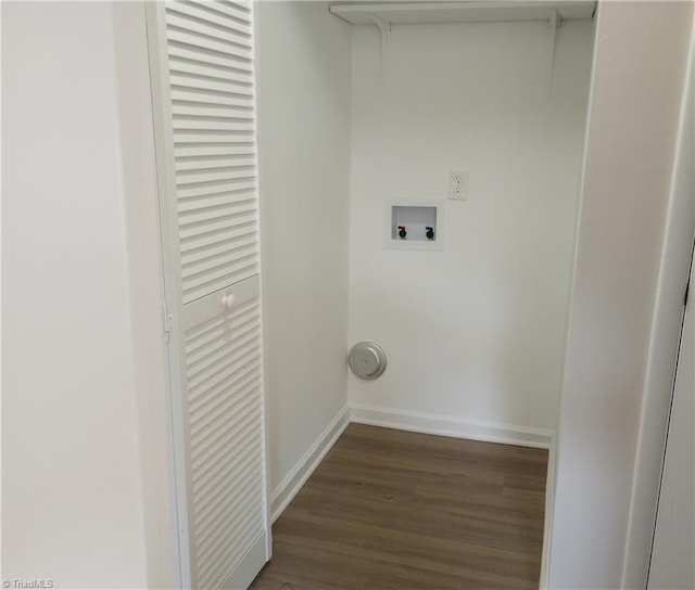 washroom with hookup for a washing machine and dark hardwood / wood-style flooring