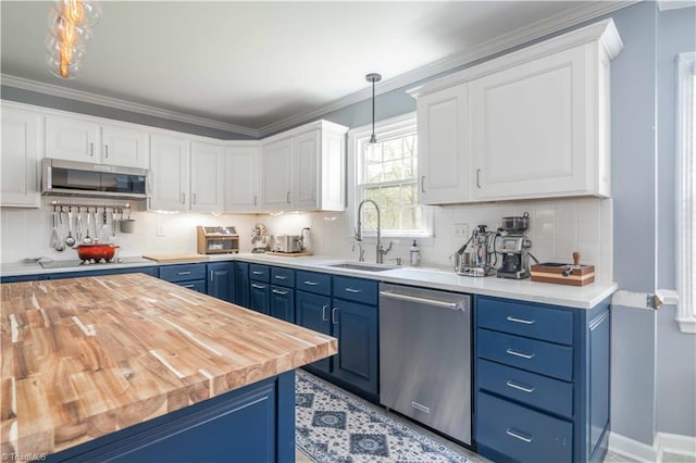 kitchen featuring wood counters, blue cabinets, and stainless steel appliances