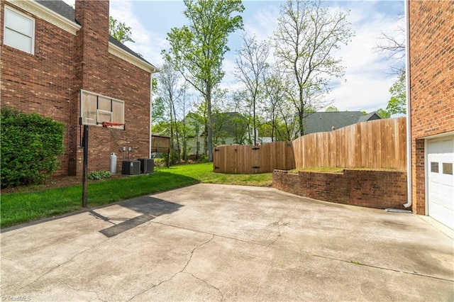 view of patio with fence and cooling unit