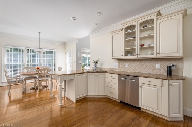 5000 Casting Way, Greensboro, NC 27455 - kitchen featuring dishwasher, a peninsula, ornamental molding, glass insert cabinets, and dark wood-style flooring