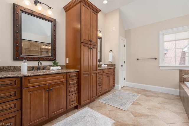 5000 Casting Way, Greensboro, NC 27455 - full bath with vanity, a tub to relax in, and vaulted ceiling