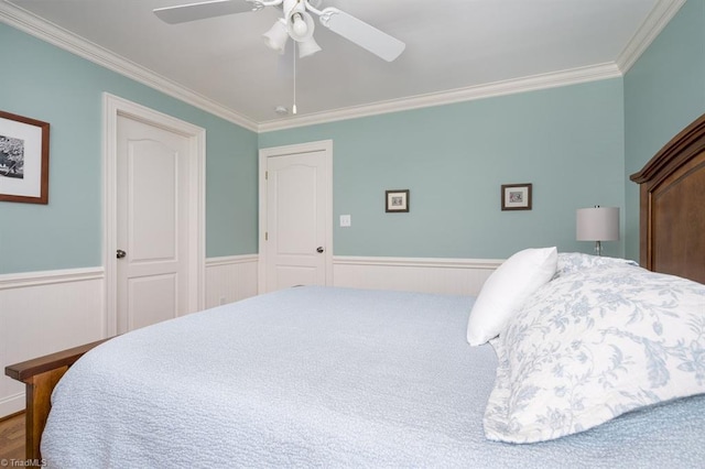 5000 Casting Way, Greensboro, NC 27455 - bedroom featuring crown molding, a wainscoted wall, and a ceiling fan