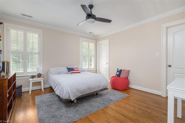 5000 Casting Way, Greensboro, NC 27455 - bedroom with wood finished floors, ornamental molding, and a ceiling fan