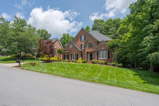 5000 Casting Way, Greensboro, NC 27455 - traditional-style home with brick siding and a front yard