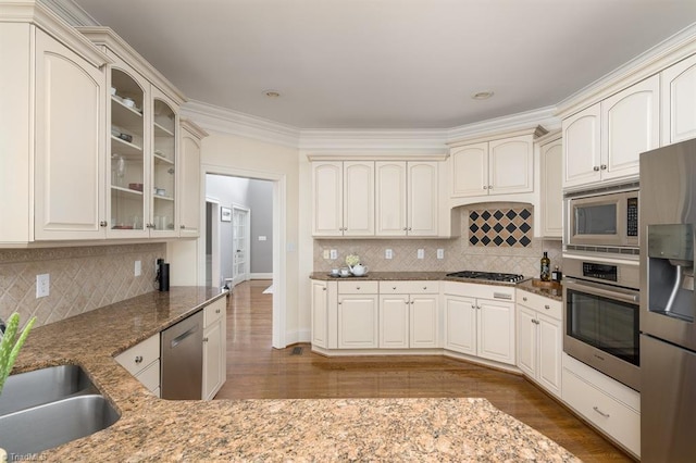 5000 Casting Way, Greensboro, NC 27455 - kitchen featuring stainless steel appliances, cream cabinets, dark stone counters, decorative backsplash, and recessed lighting