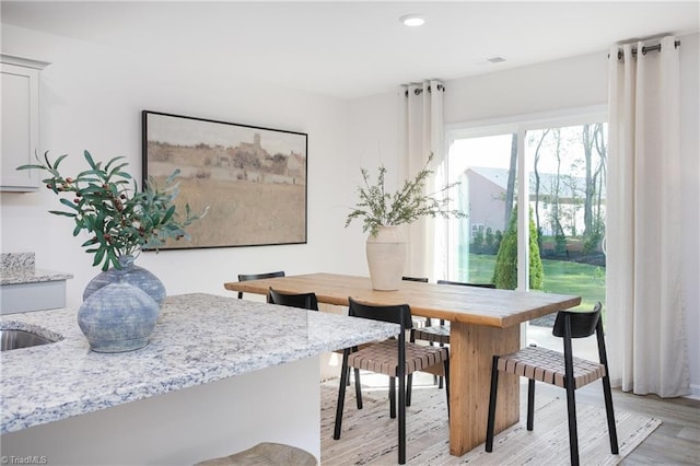 dining area featuring light wood-type flooring