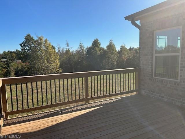 deck featuring a lawn