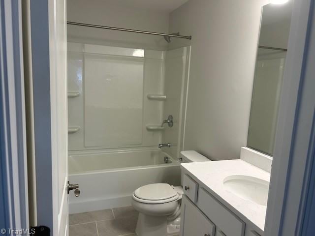 full bathroom with shower / tub combination, vanity, tile patterned floors, and toilet