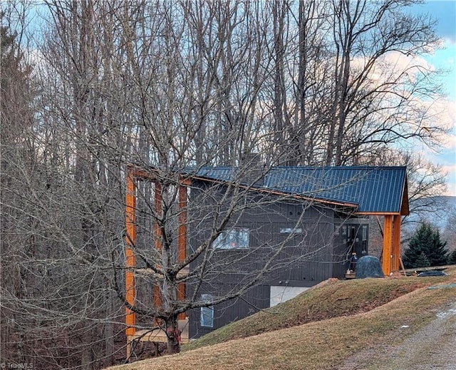 view of side of property with metal roof