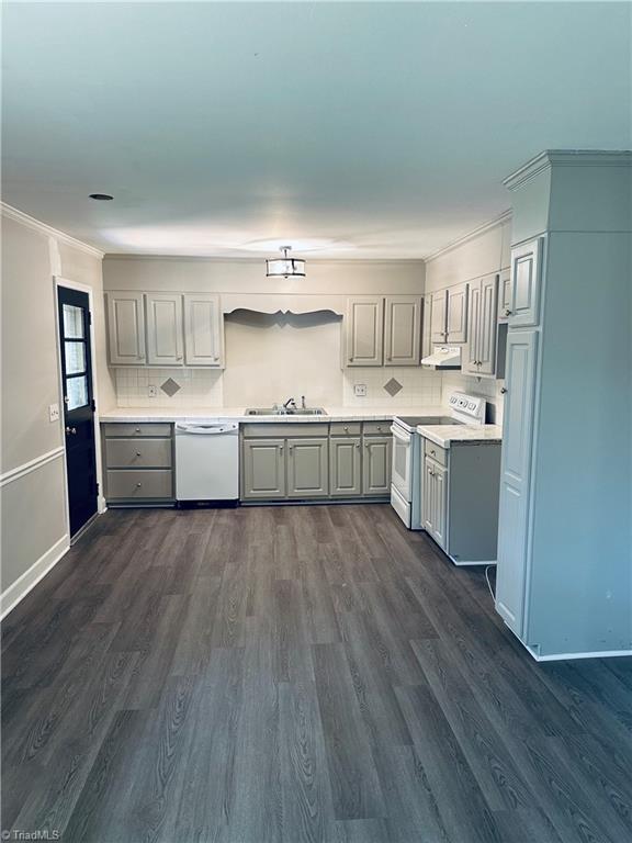 702 Trail One, Burlington, NC 27215 - kitchen with white appliances, gray cabinets, a sink, ornamental molding, and dark wood finished floors