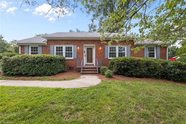 2206 Revolan Dr, Greensboro, NC 27407 - view of front of house featuring brick siding and a front lawn
