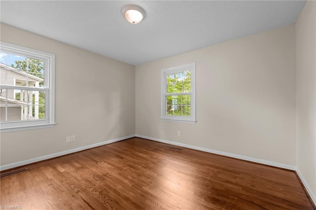 2206 Revolan Dr, Greensboro, NC 27407 - empty room with wood finished floors and baseboards
